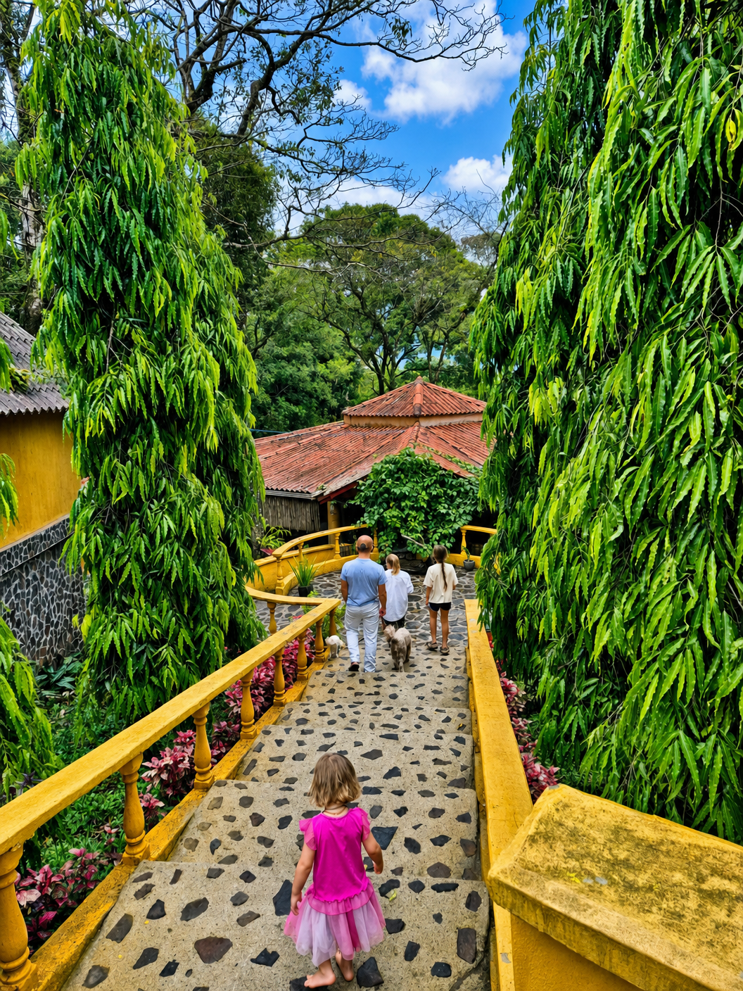 Family walking through lush tropical garden path in Panama